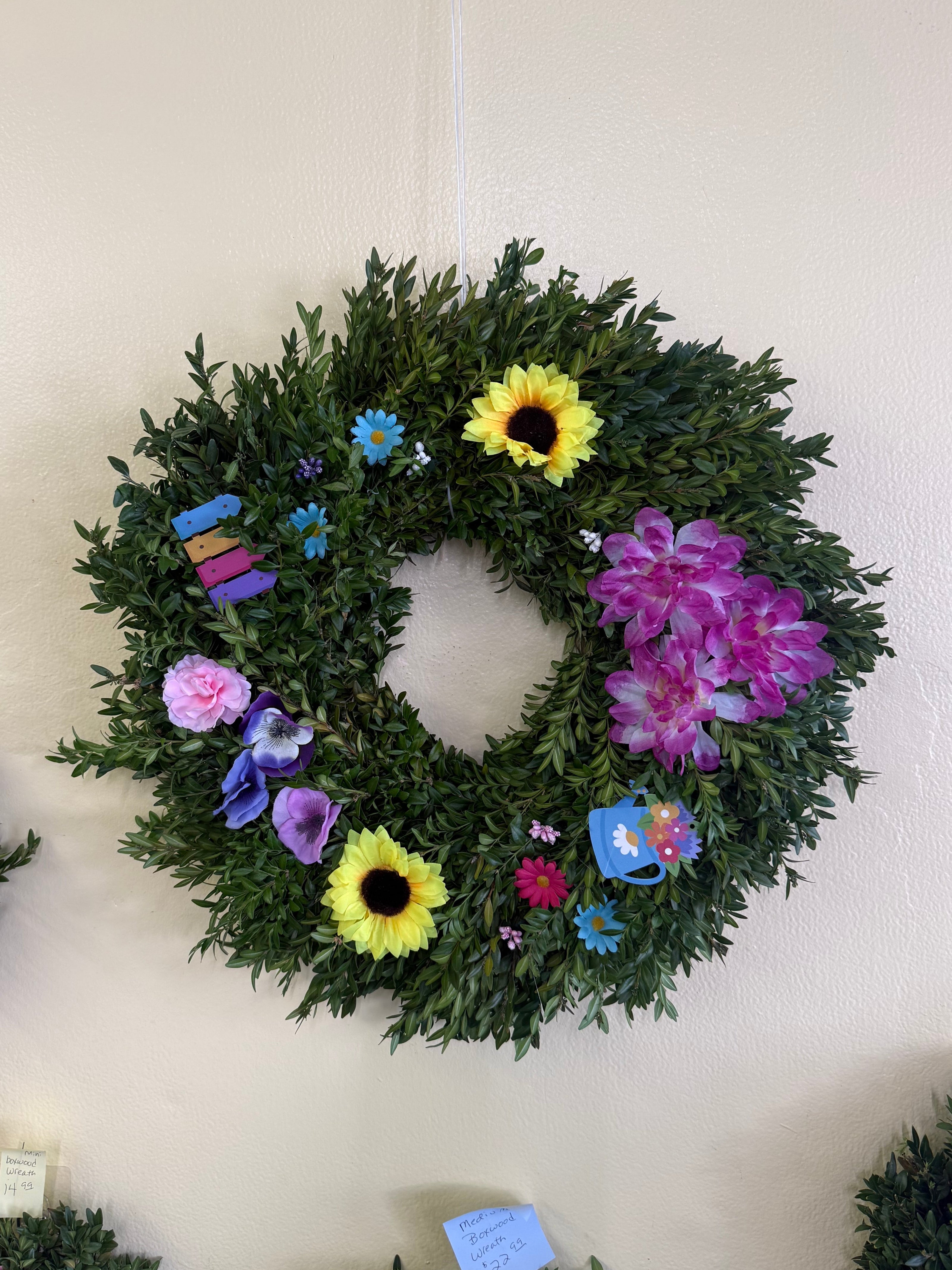 Decorative wreaths with flowers on a light background
